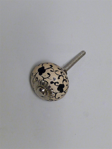 Cremehvid massiv polystoneknop m. sort h�ndmalet m�nster og forkromet metal, mellemstor.